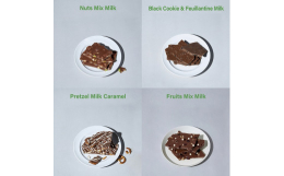 4種類のミルクチョコレートアソート。１．食感・風味のことなる、アーモンド、ピスタチオ、マカダミアナッツを混ぜ込んだ「ナッツミックス ミルク」２．ミルクチョコレートに、ほろ苦いブラッククッキーと薄焼きク